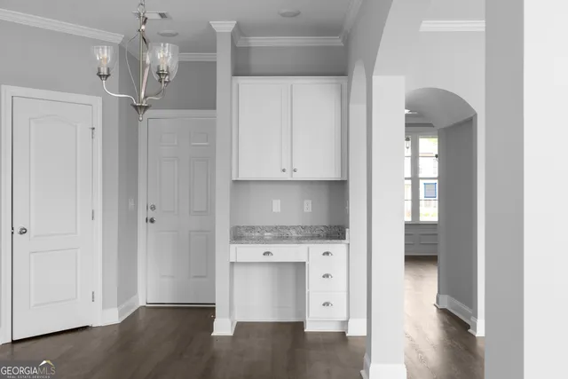 a view of cabinets and wooden floor