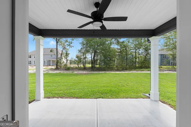 a view of a backyard with a garden and plants