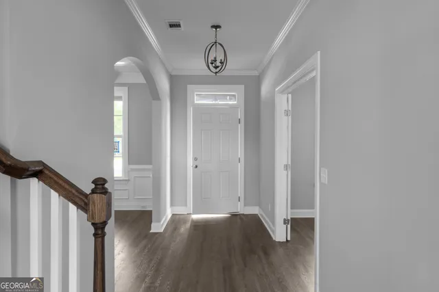 a view of entryway with wooden floor