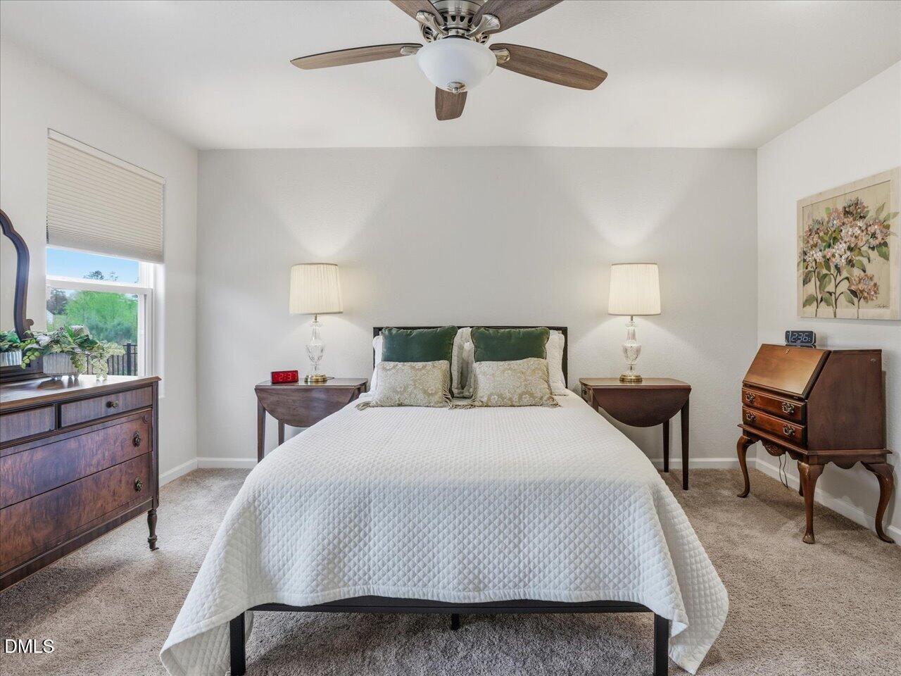 90 Barnsley Road Angier, NC 27501 - Photo 19 of 40 a bedroom with bed and window