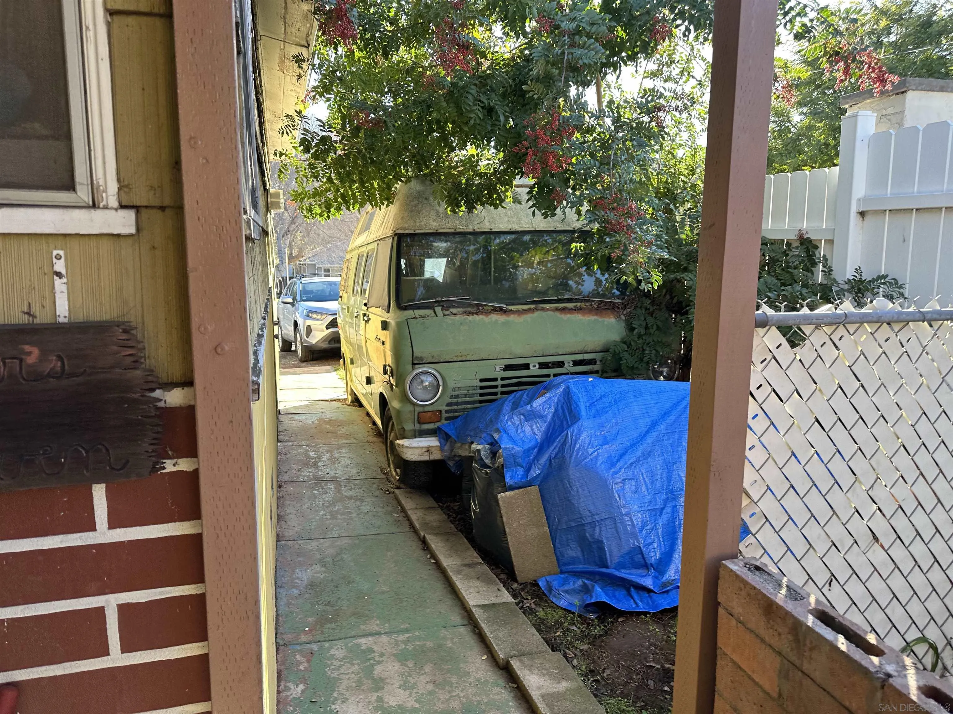 10744 Louisa Drive La Mesa, CA 91941 - Photo 6 of 19 a view of a house with a trees in the background