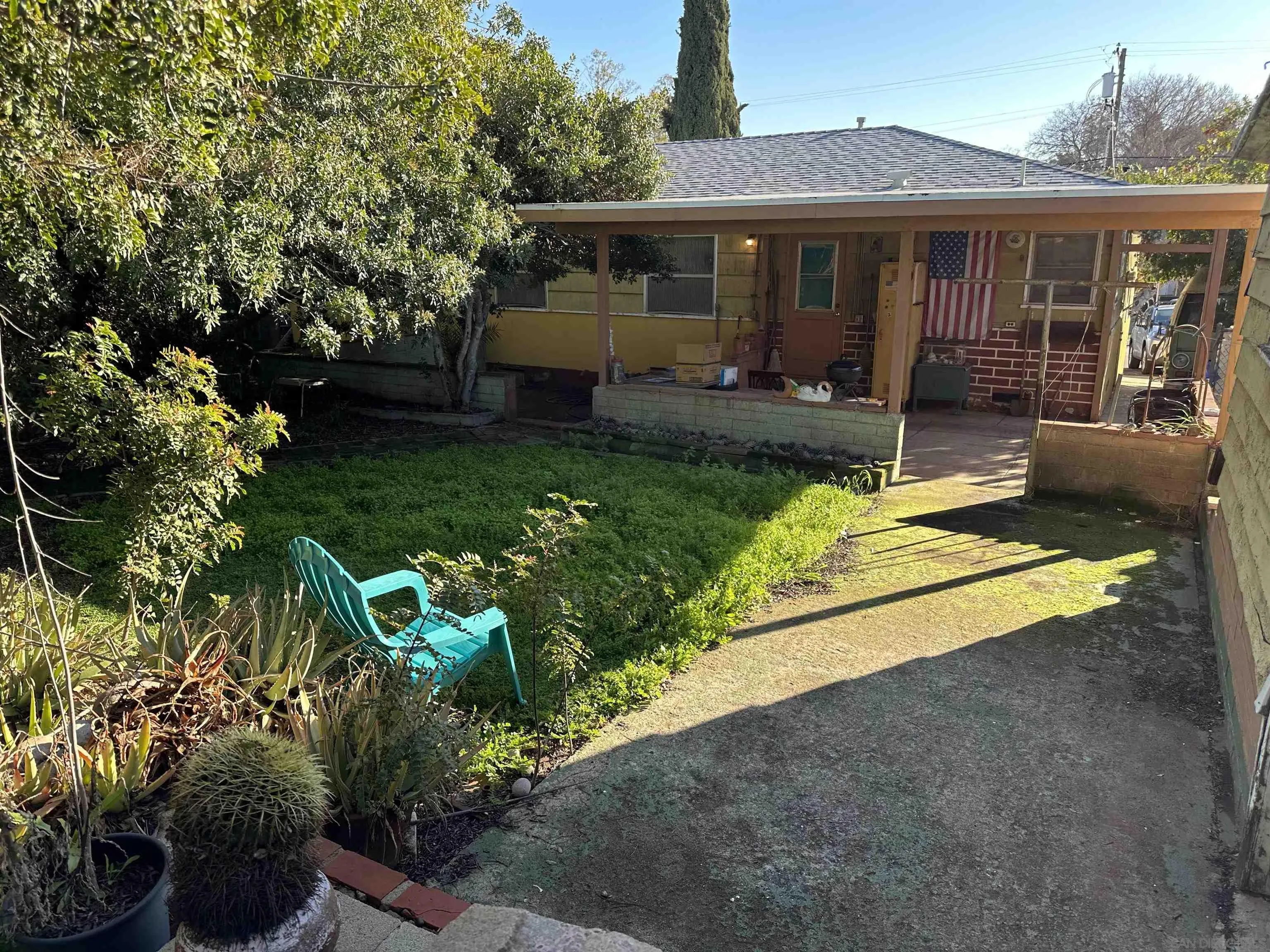 10744 Louisa Drive La Mesa, CA 91941 - Photo 10 of 19 a front view of a house with a yard and potted plants