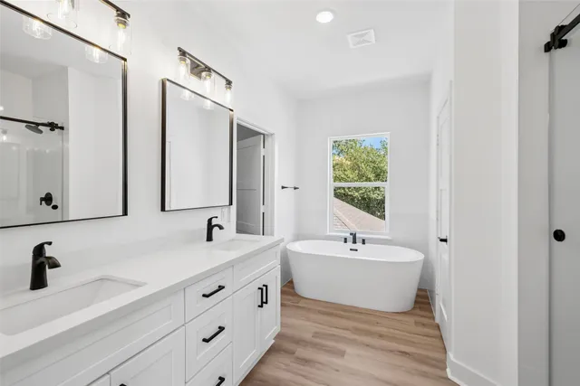 a bathroom with a glass shower door