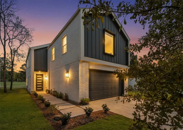 a yellow house with trees in front of it