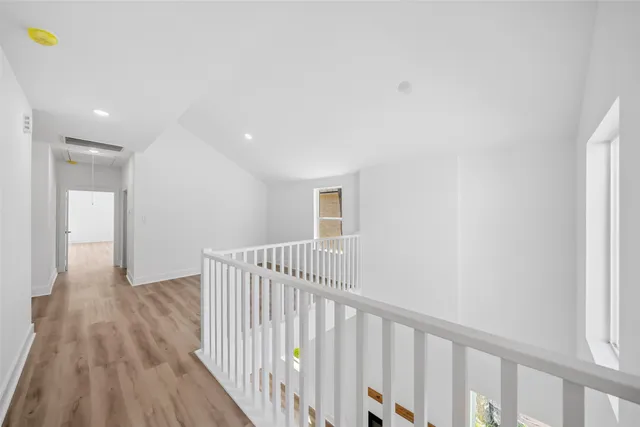 a view of a small space with wooden floor