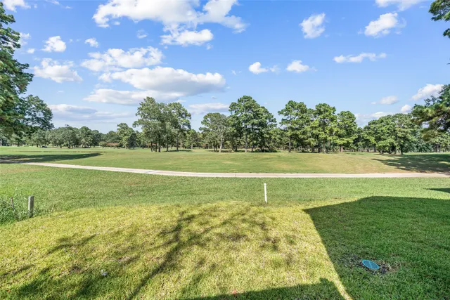 a view of a golf course with a house