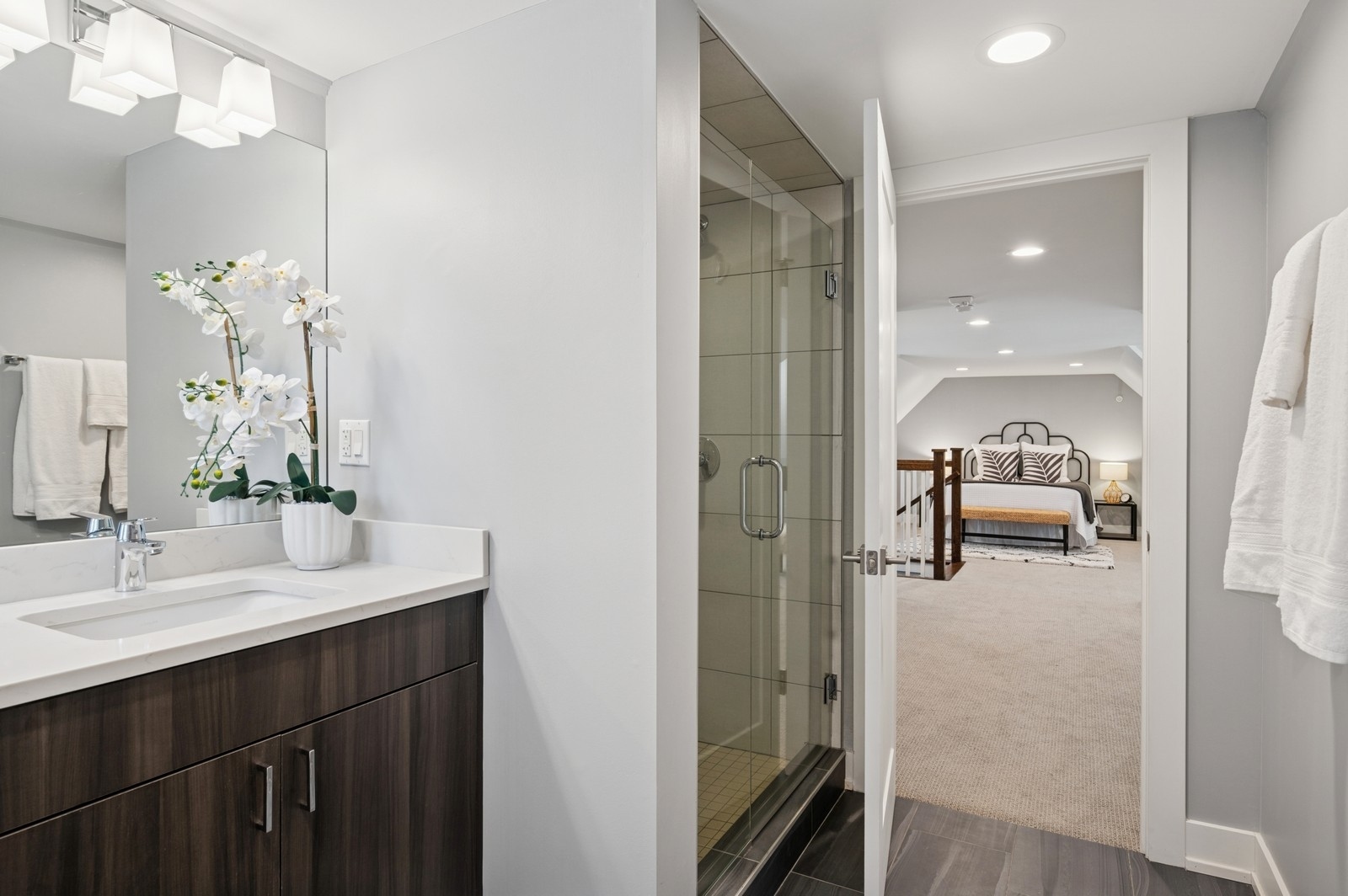 2119 Pioneer Road Evanston, IL 60201 - Photo 28 of 36 a en suite bathroom with a sink a mirror and shower