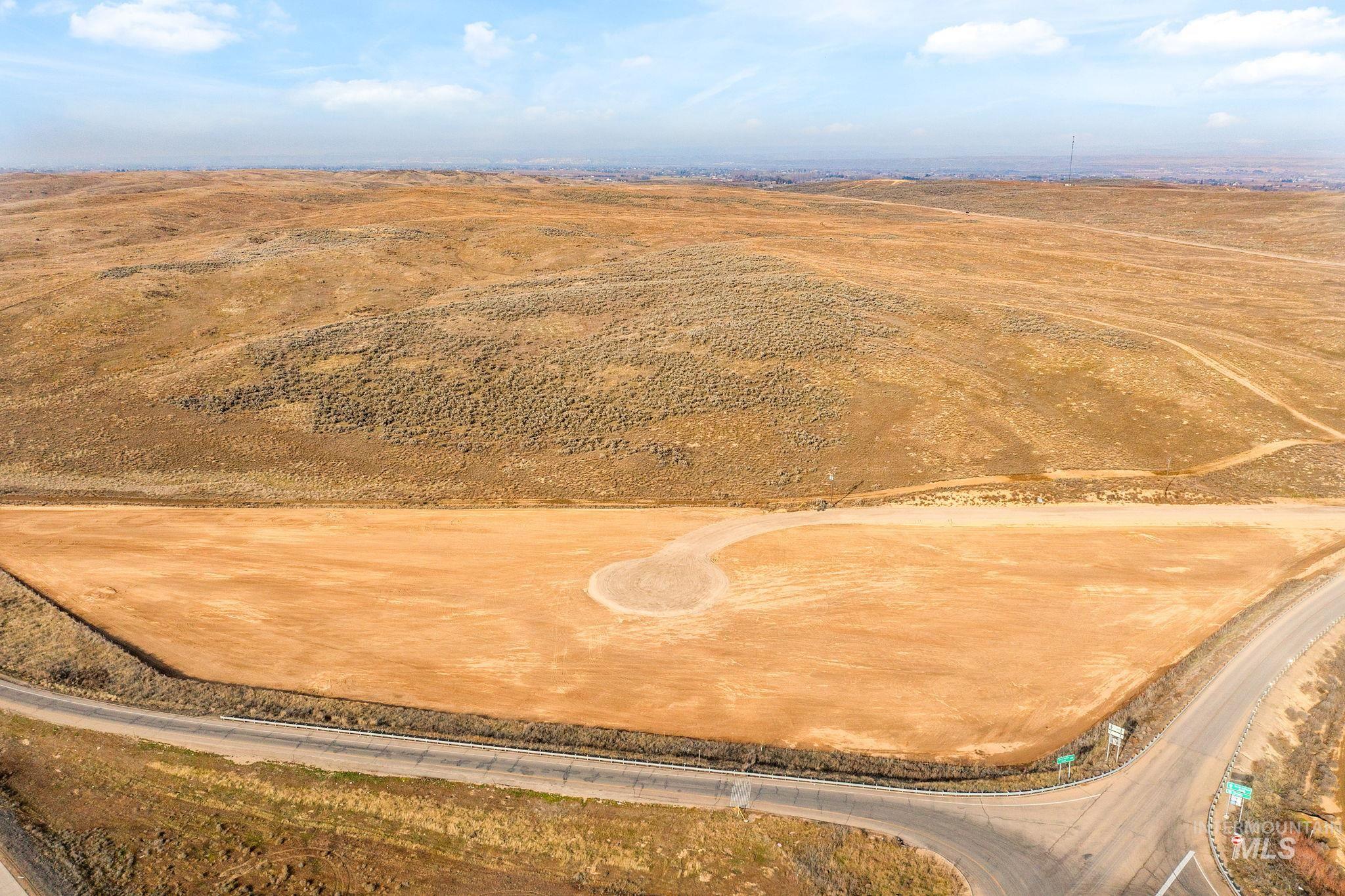 5400-5404 Black Canyon Road Caldwell, ID 83607 - Photo 3 of 12 Aerial view of sparsely populated area with a desert landscape