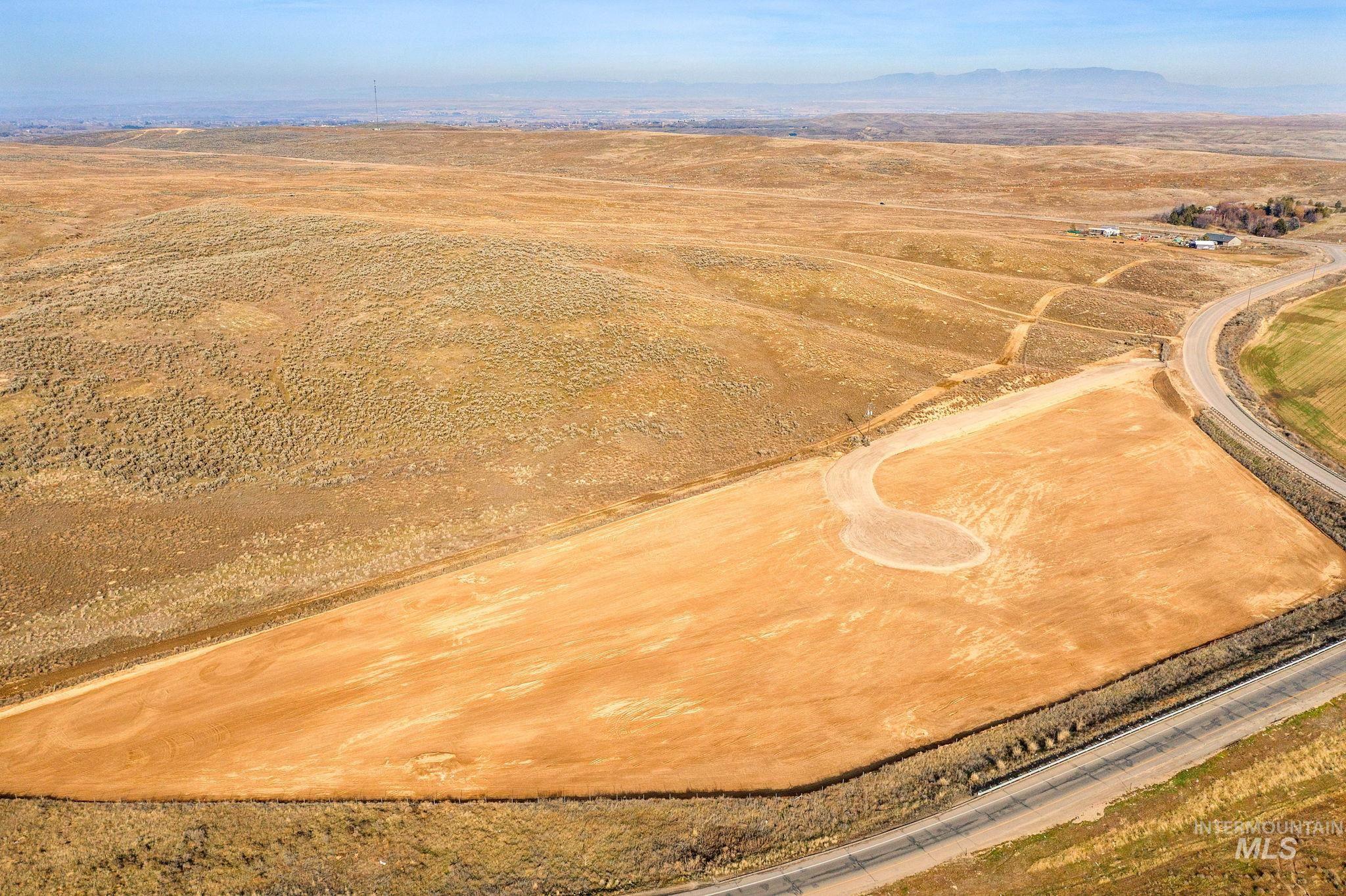 5400-5404 Black Canyon Road Caldwell, ID 83607 - Photo 4 of 12 Overview of rural landscape with mountains and a desert landscape