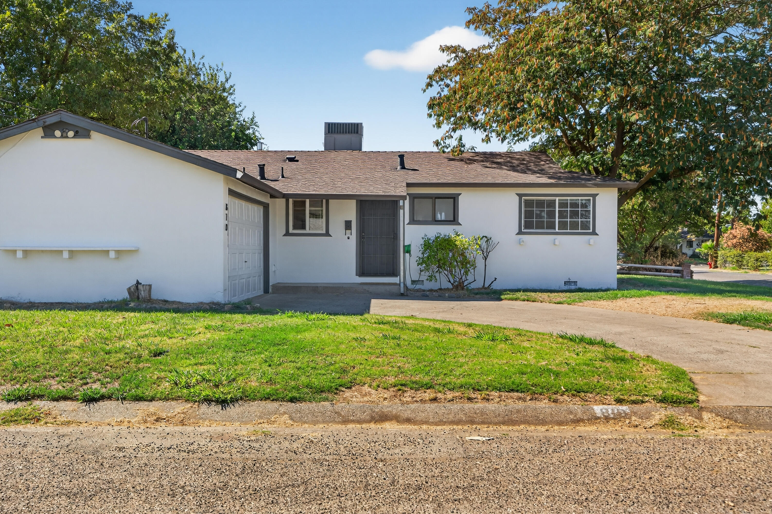 a view of a house with a yard and plants