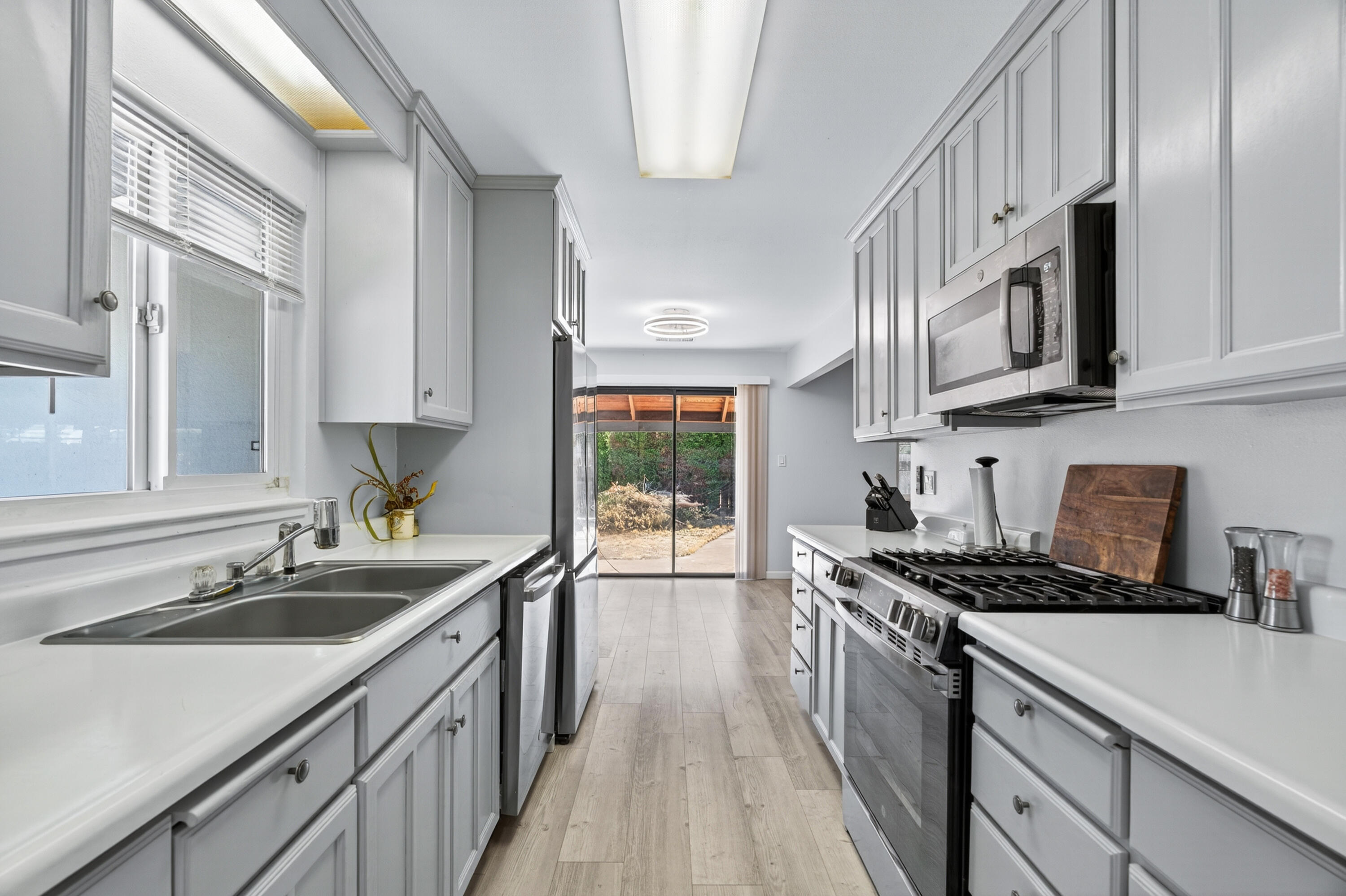 810 Cascade Avenue Red Bluff, CA 96080 - Photo 11 of 23 a kitchen that has a sink and a stove