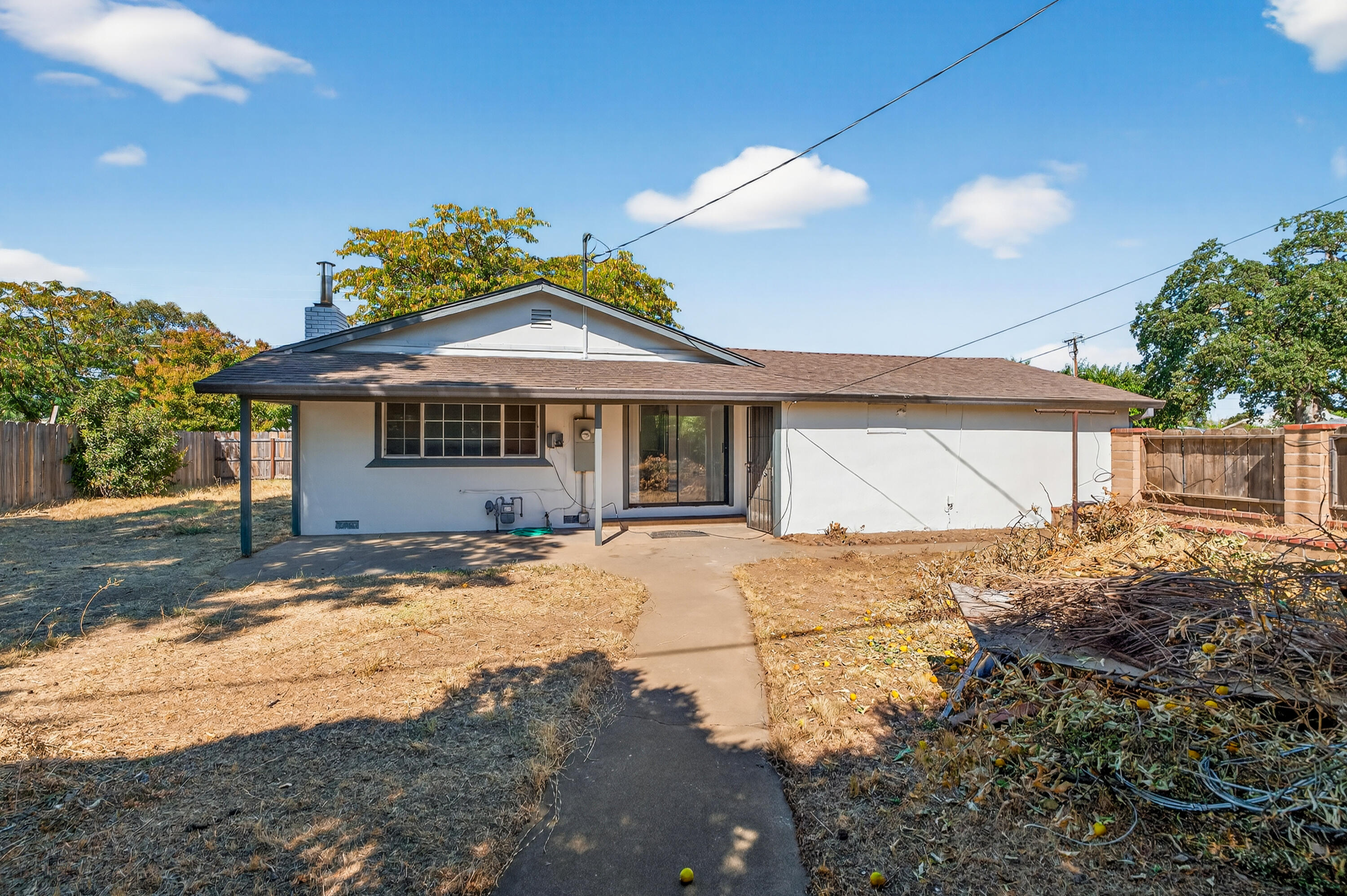 810 Cascade Avenue Red Bluff, CA 96080 - Photo 20 of 23 a front view of a house with a garden and patio