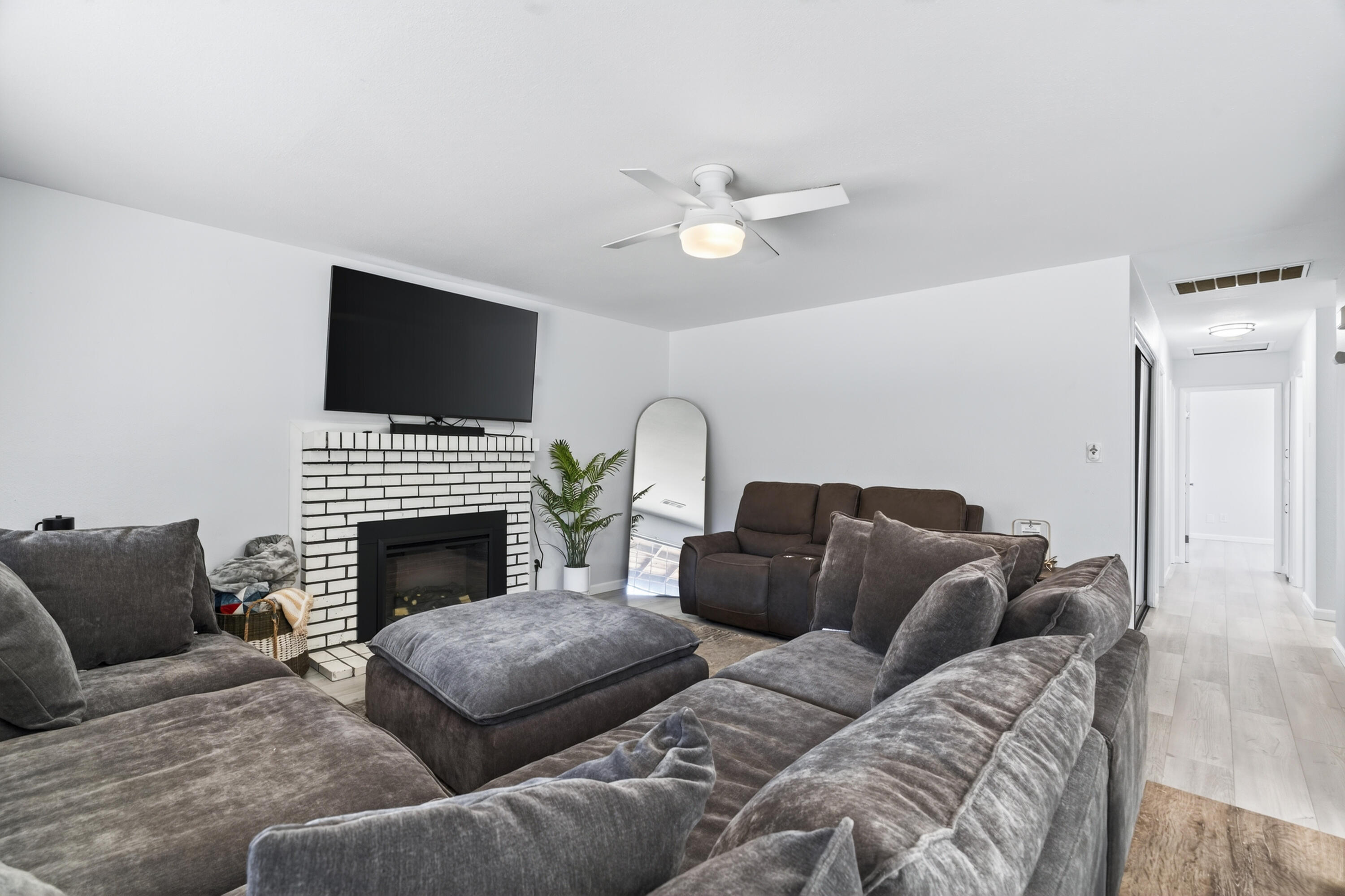 810 Cascade Avenue Red Bluff, CA 96080 - Photo 5 of 23 a living room with furniture a fireplace and a flat screen tv