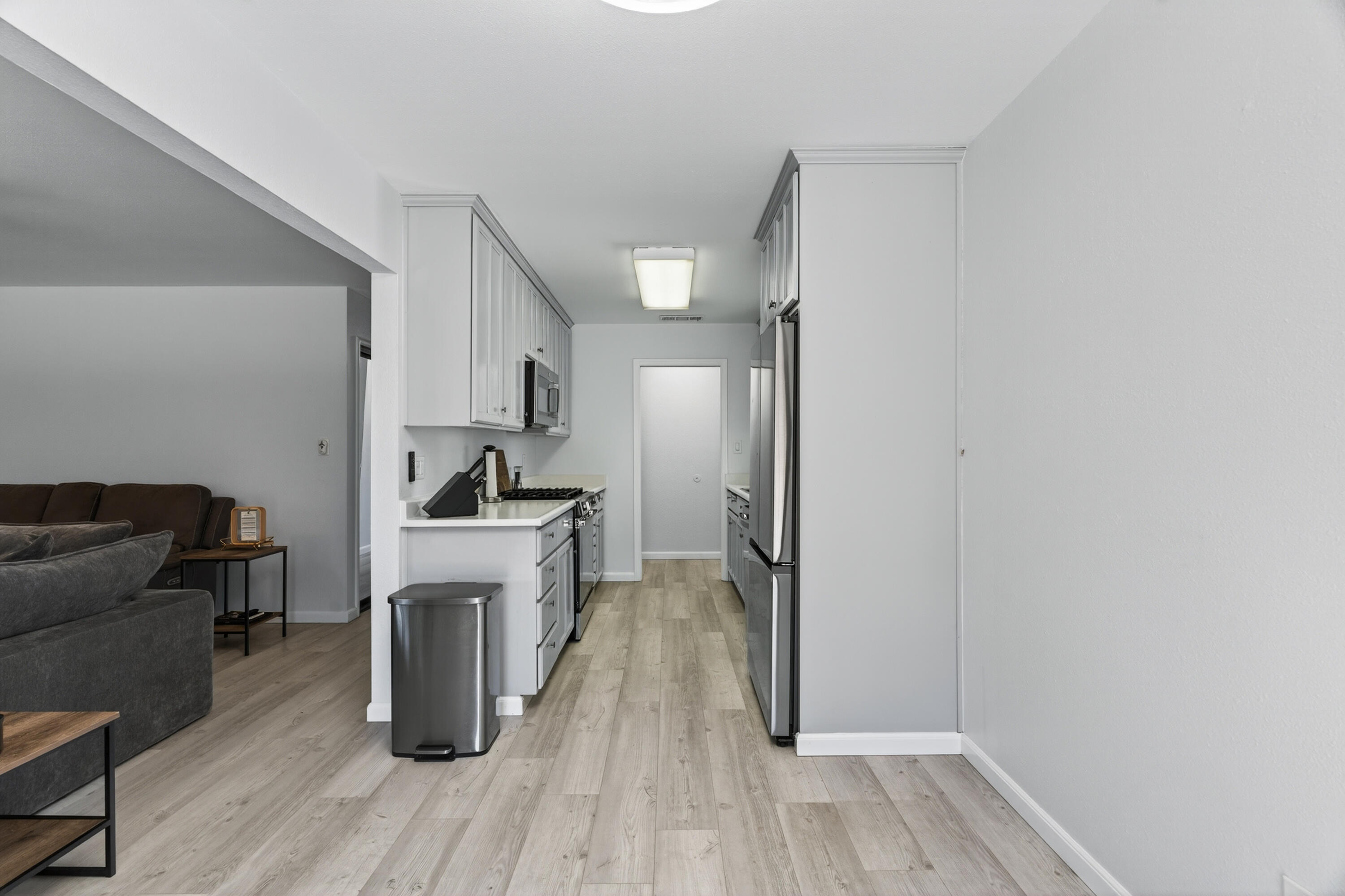 810 Cascade Avenue Red Bluff, CA 96080 - Photo 9 of 23 a kitchen with a refrigerator and a stove top oven
