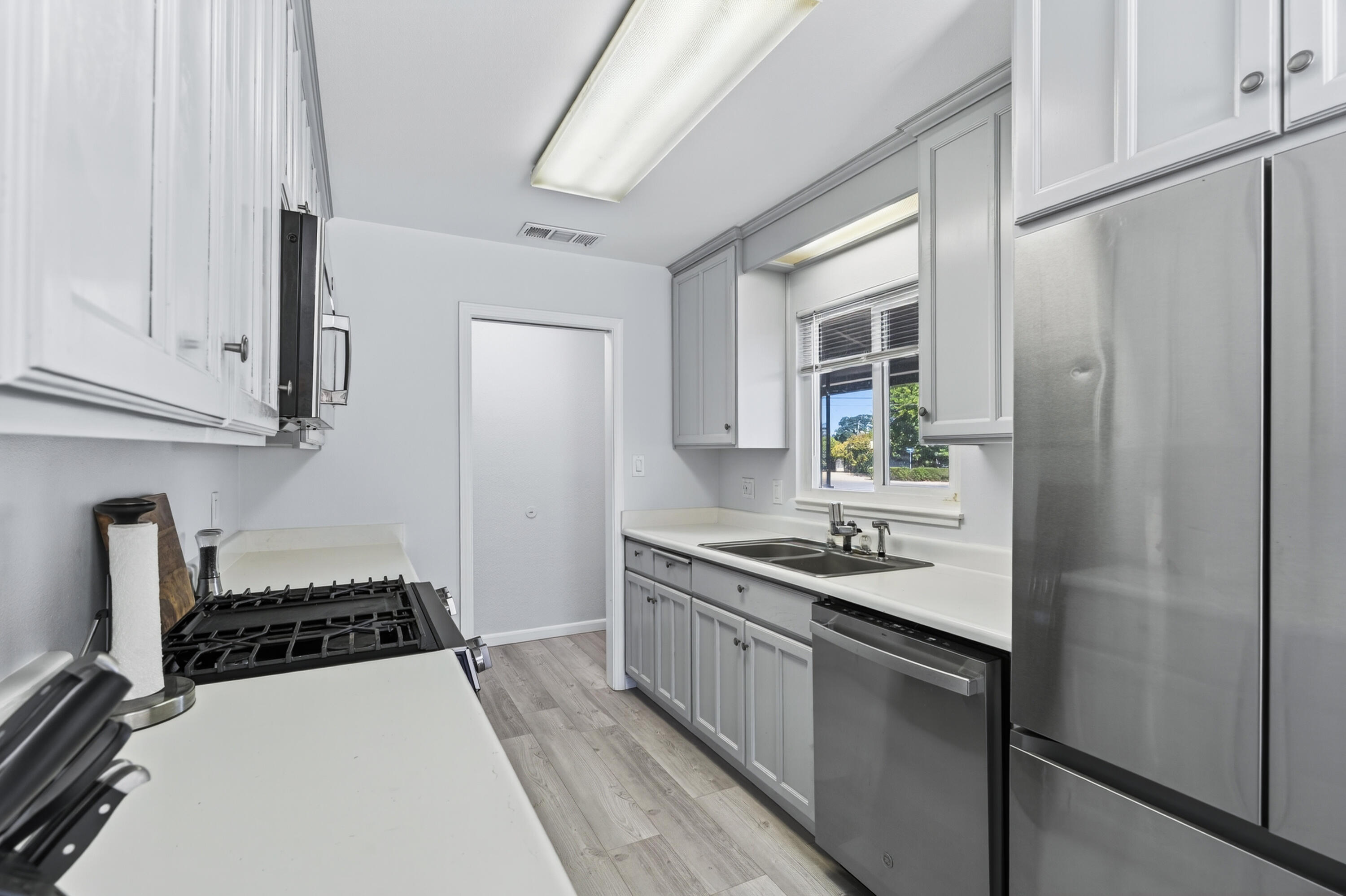 810 Cascade Avenue Red Bluff, CA 96080 - Photo 10 of 23 a kitchen with stainless steel appliances a sink stove and refrigerator