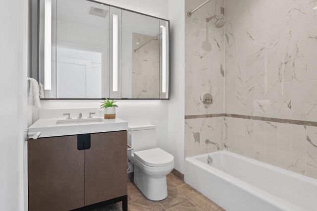 a bathroom with a sink a toilet and a bathtub