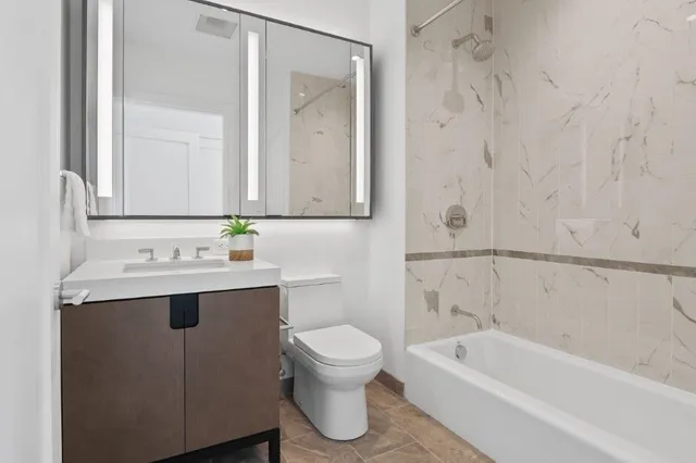 a bathroom with a sink a toilet and a bathtub