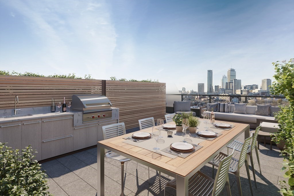 380 Harrison Avenue, Unit 14J Boston, MA 02118 - Photo 15 of 37 a view of a terrace with furniture and city view