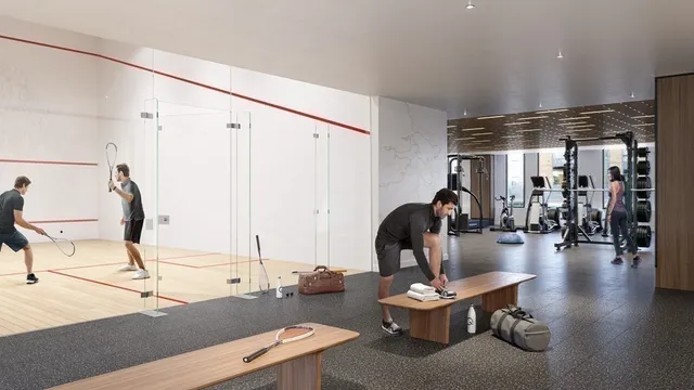 a living room with furniture and gym equipment