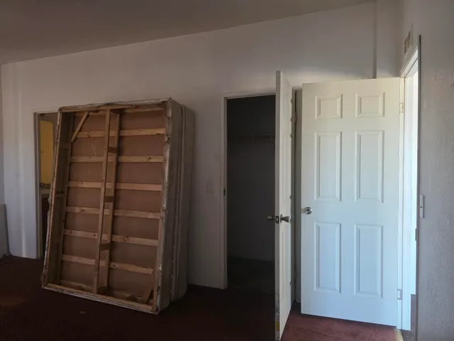 a view of storage and utility room with closet