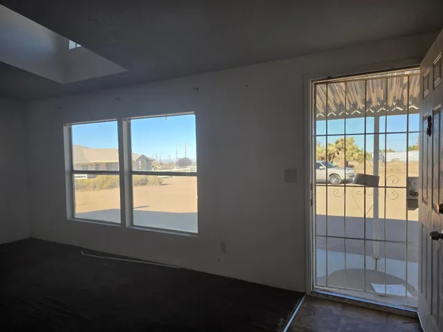 a room with a window and a couch