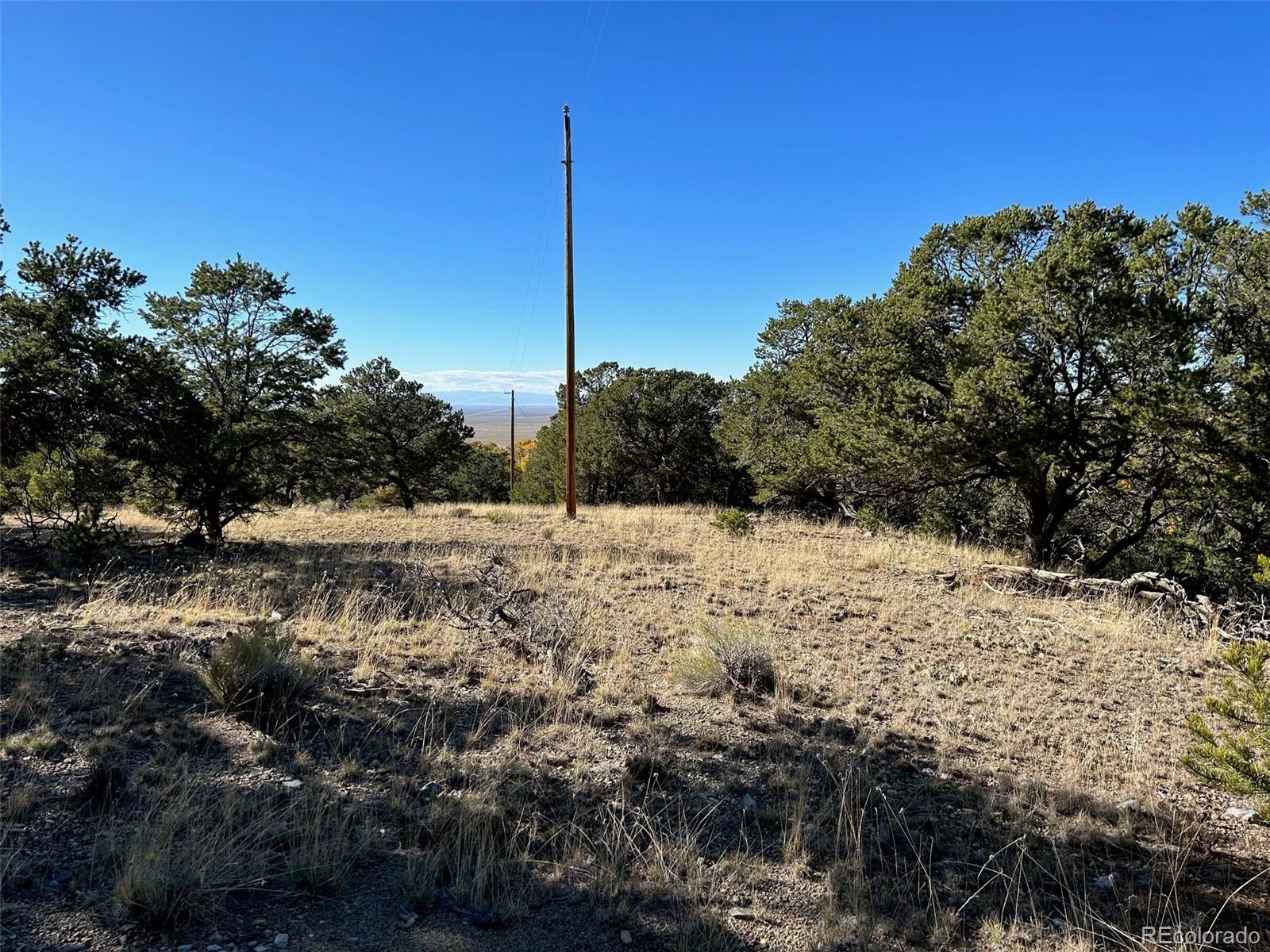 124 Indian Hill Road Mosca, CO 81146 - Photo 6 of 9 a view of a covered with snow on the road