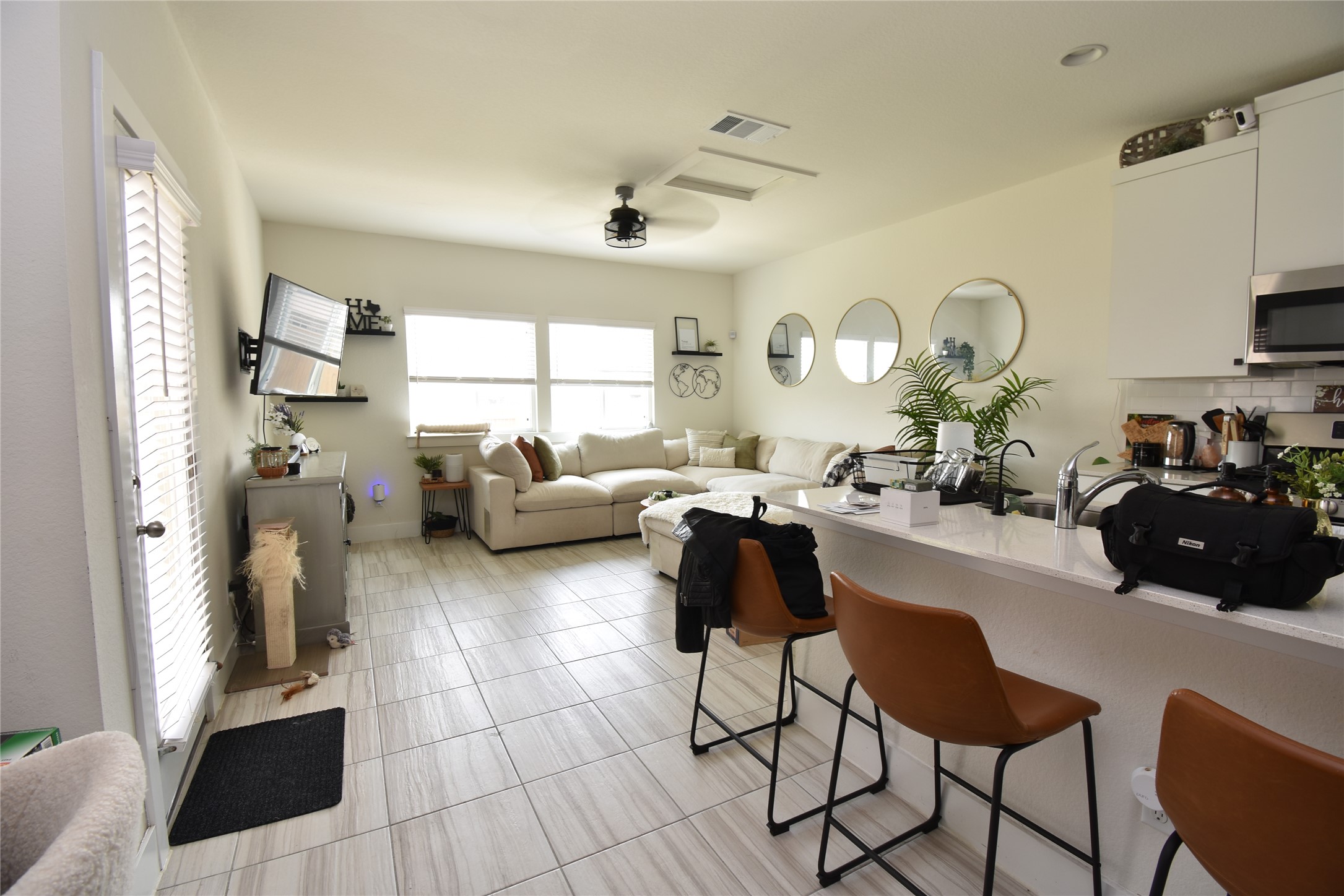 331 Alamar Knot Way, Unit 208 Georgetown, TX 78626 - Photo 17 of 17 An open floorplan seamlessly connects the living area with a well-appointed kitchen, ideal for entertaining.