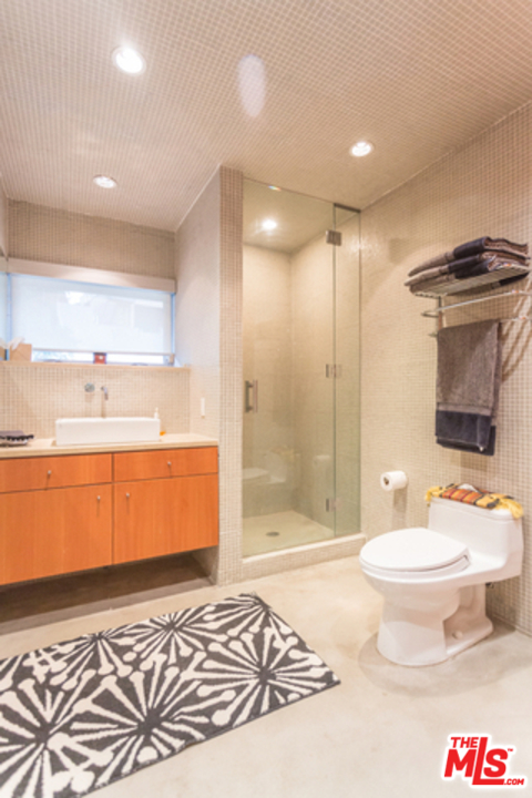 1230 Shadow Hill Way Beverly Hills, CA 90210 - Photo 14 of 22 a bathroom with a sink a toilet and shower