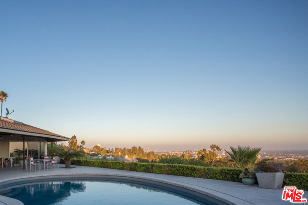 1230 Shadow Hill Way Beverly Hills, CA 90210 - Photo 20 of 22 a view of a swimming pool with lake view