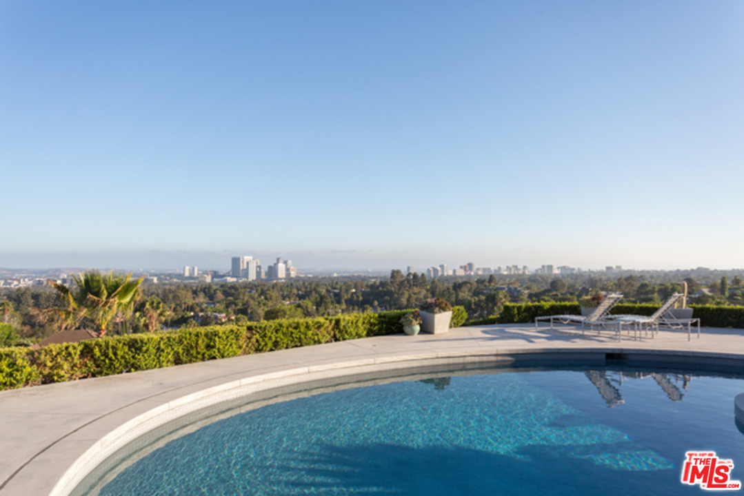 1230 Shadow Hill Way Beverly Hills, CA 90210 - Photo 22 of 22 a view of a city floor and a building in the background