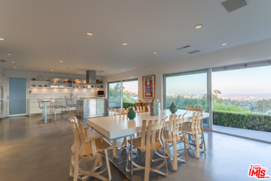 1230 Shadow Hill Way Beverly Hills, CA 90210 - Photo 6 of 22 a view of a dining room with furniture window and outside view