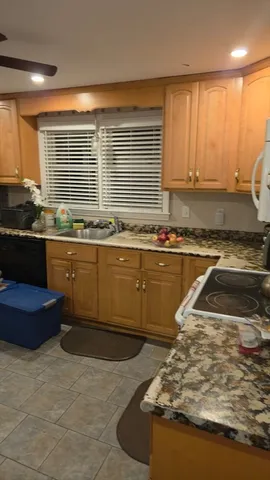 a kitchen with a sink and a stove