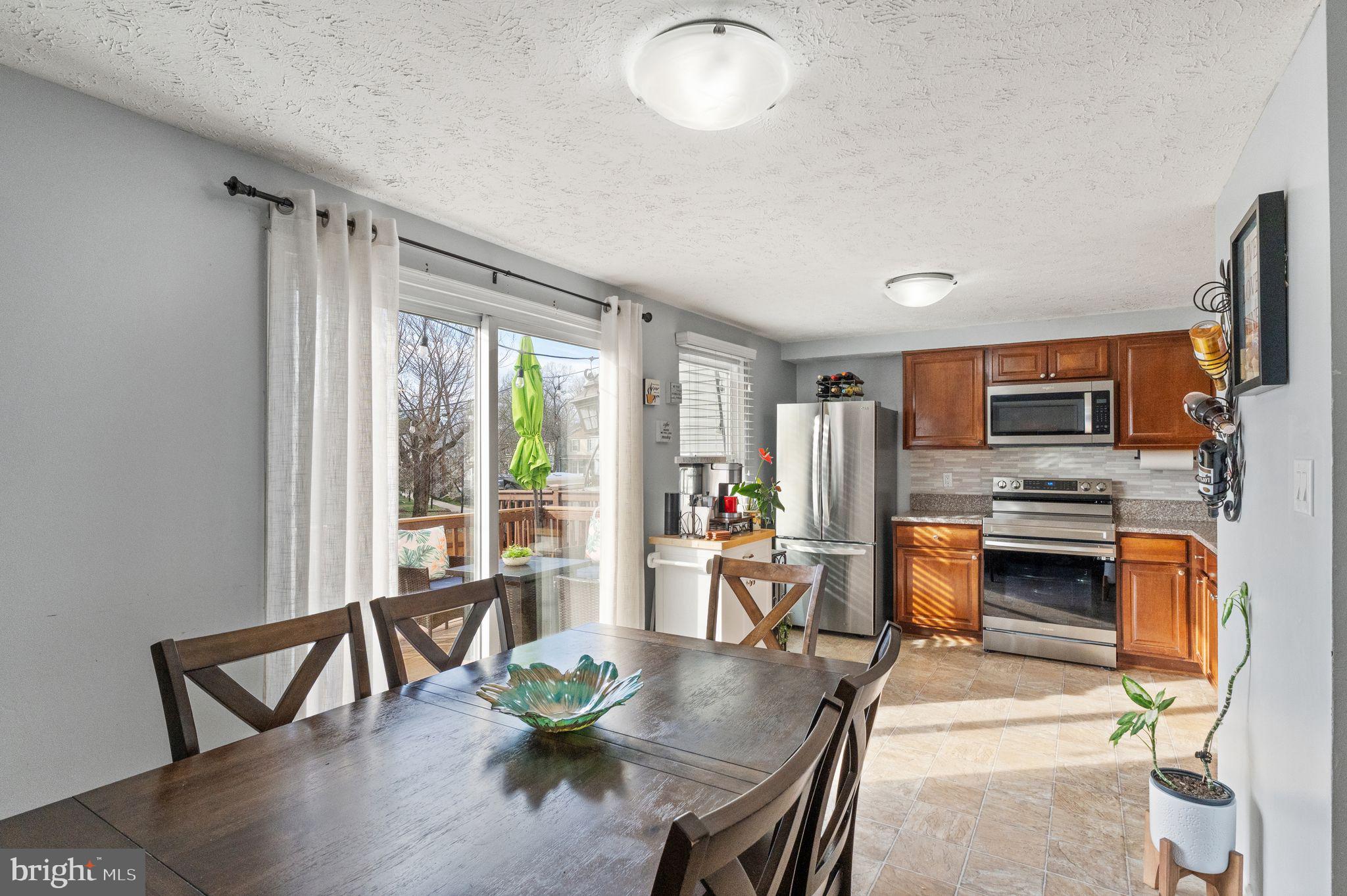 7457 Wounded Knee Road Lorton, VA 22079 - Photo 14 of 49 a living room with fireplace furniture and a flat screen tv