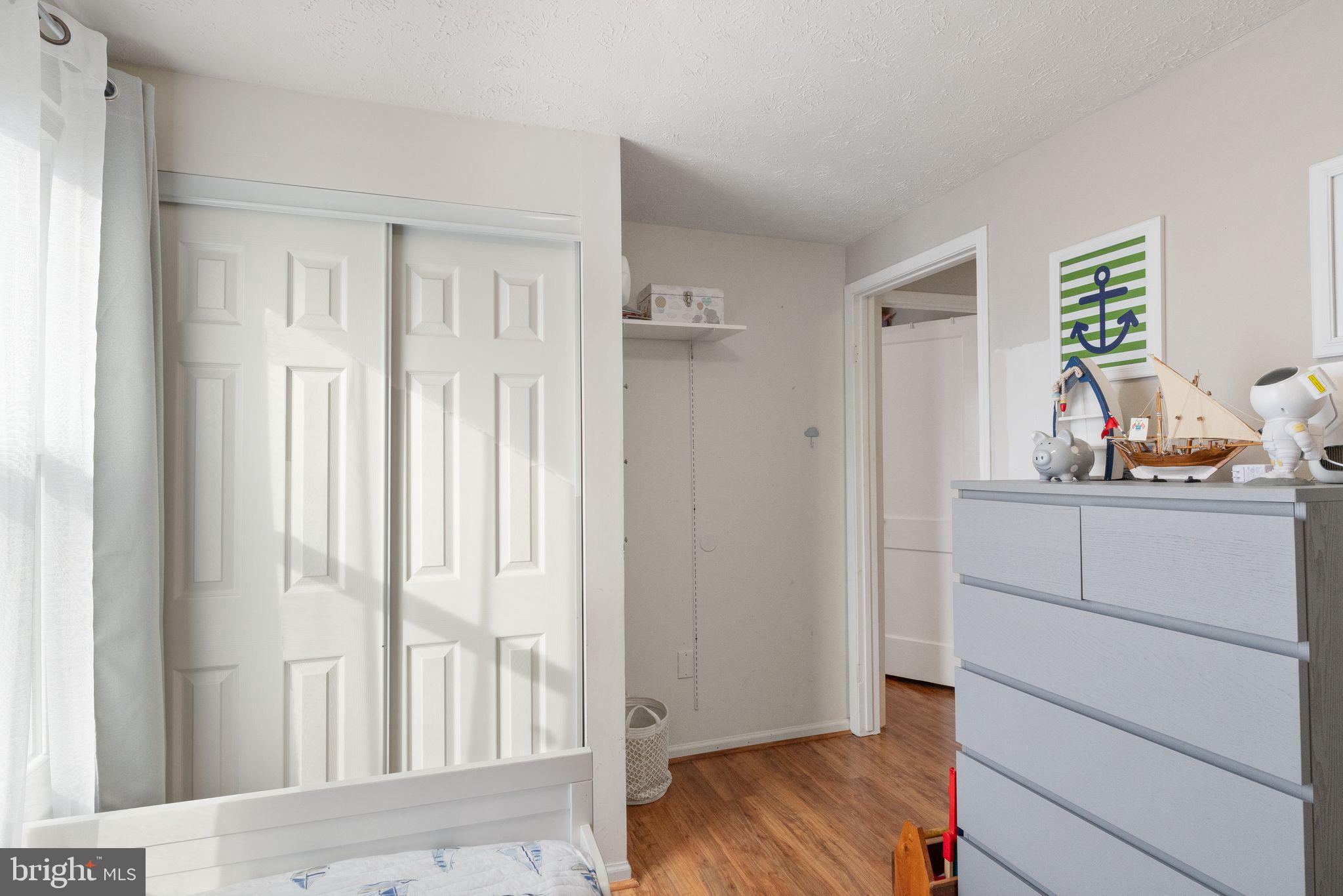 7457 Wounded Knee Road Lorton, VA 22079 - Photo 25 of 49 a view of room with hardwood floor and cabinet
