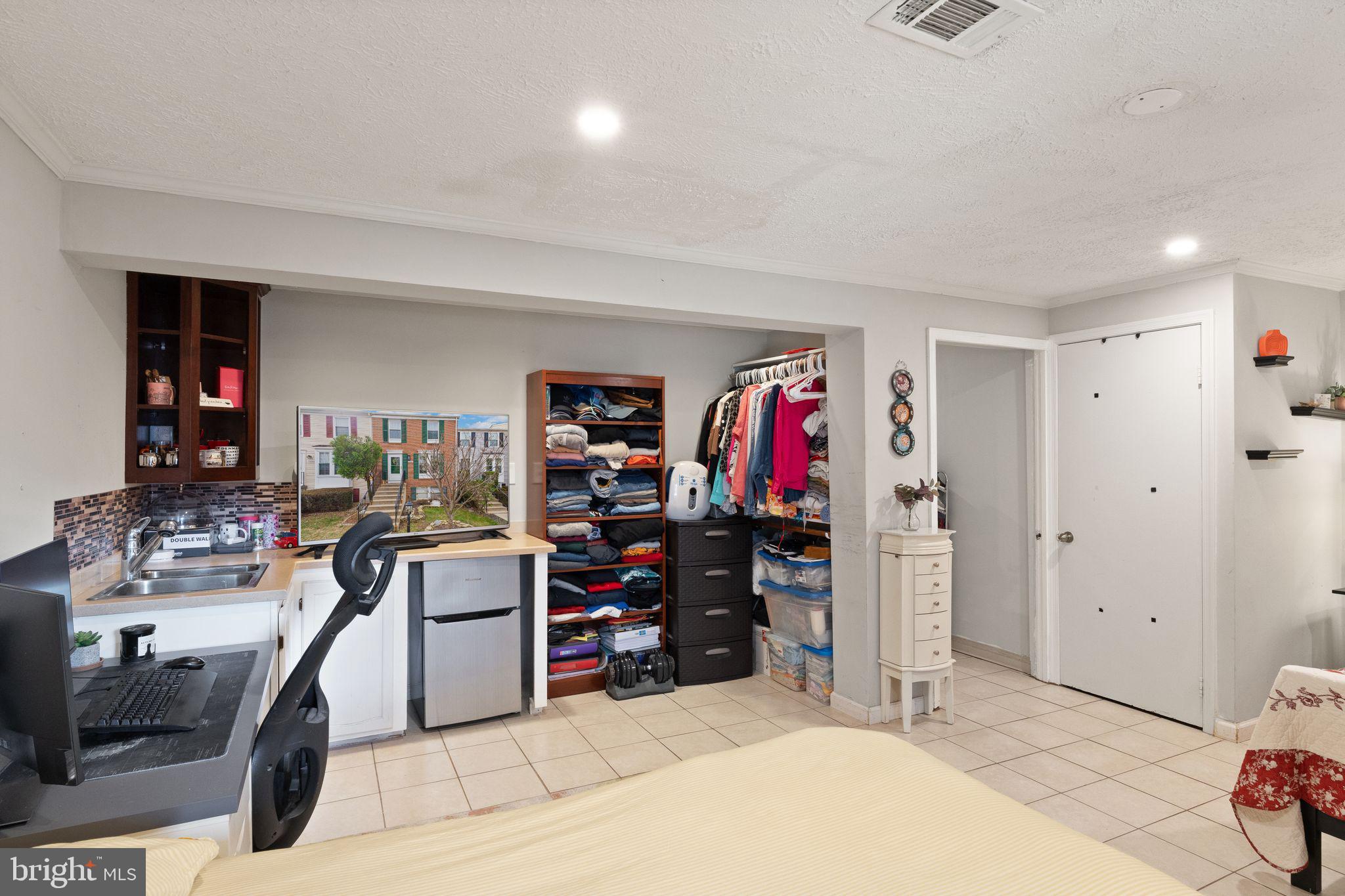 7457 Wounded Knee Road Lorton, VA 22079 - Photo 33 of 49 a view of a bedroom with workspace and bedroom