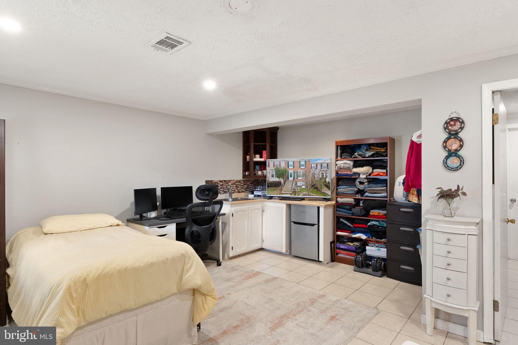 7457 Wounded Knee Road Lorton, VA 22079 - Photo 35 of 49 a bedroom with a bed and a cabinets