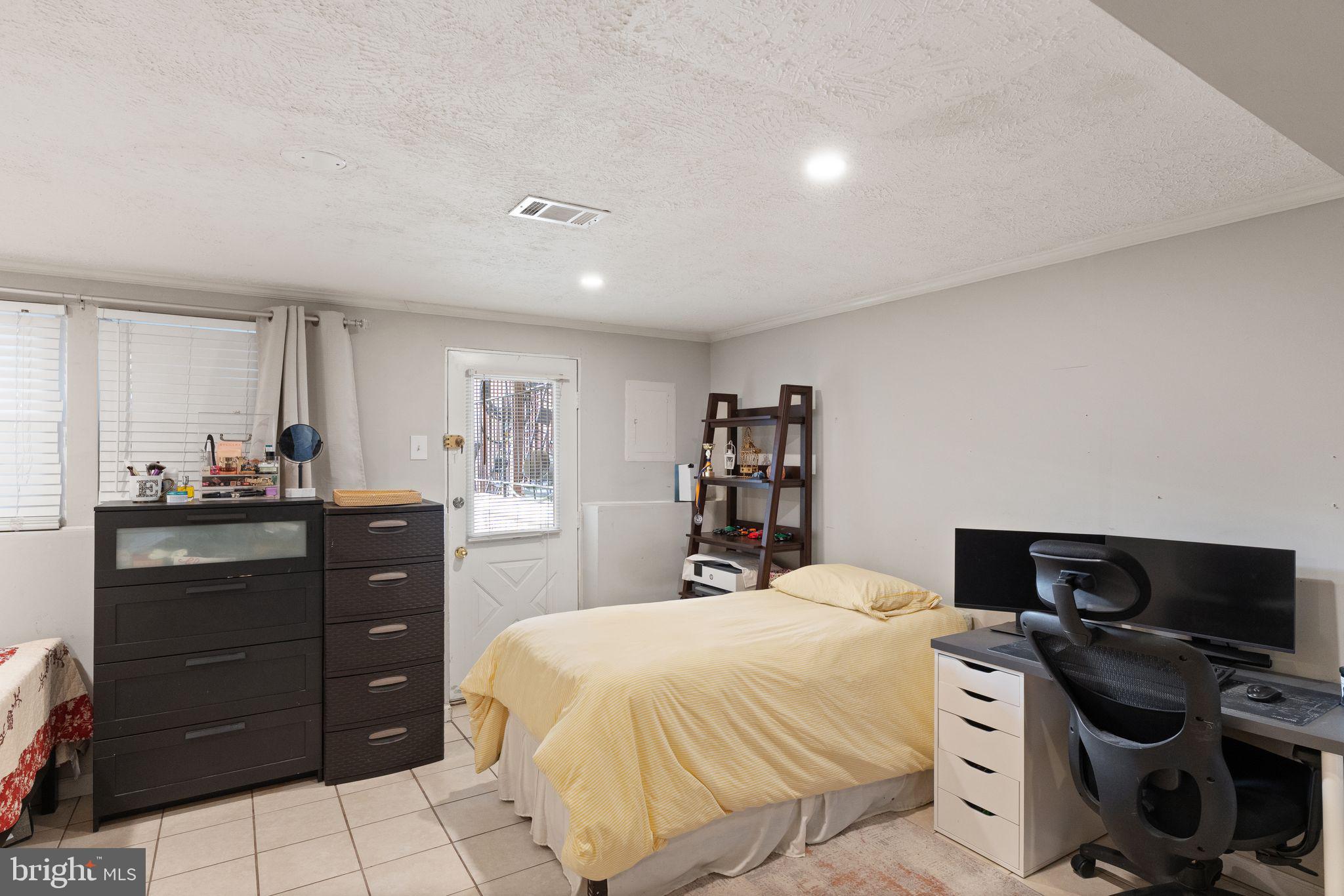 7457 Wounded Knee Road Lorton, VA 22079 - Photo 36 of 49 a bedroom with a bed and a television