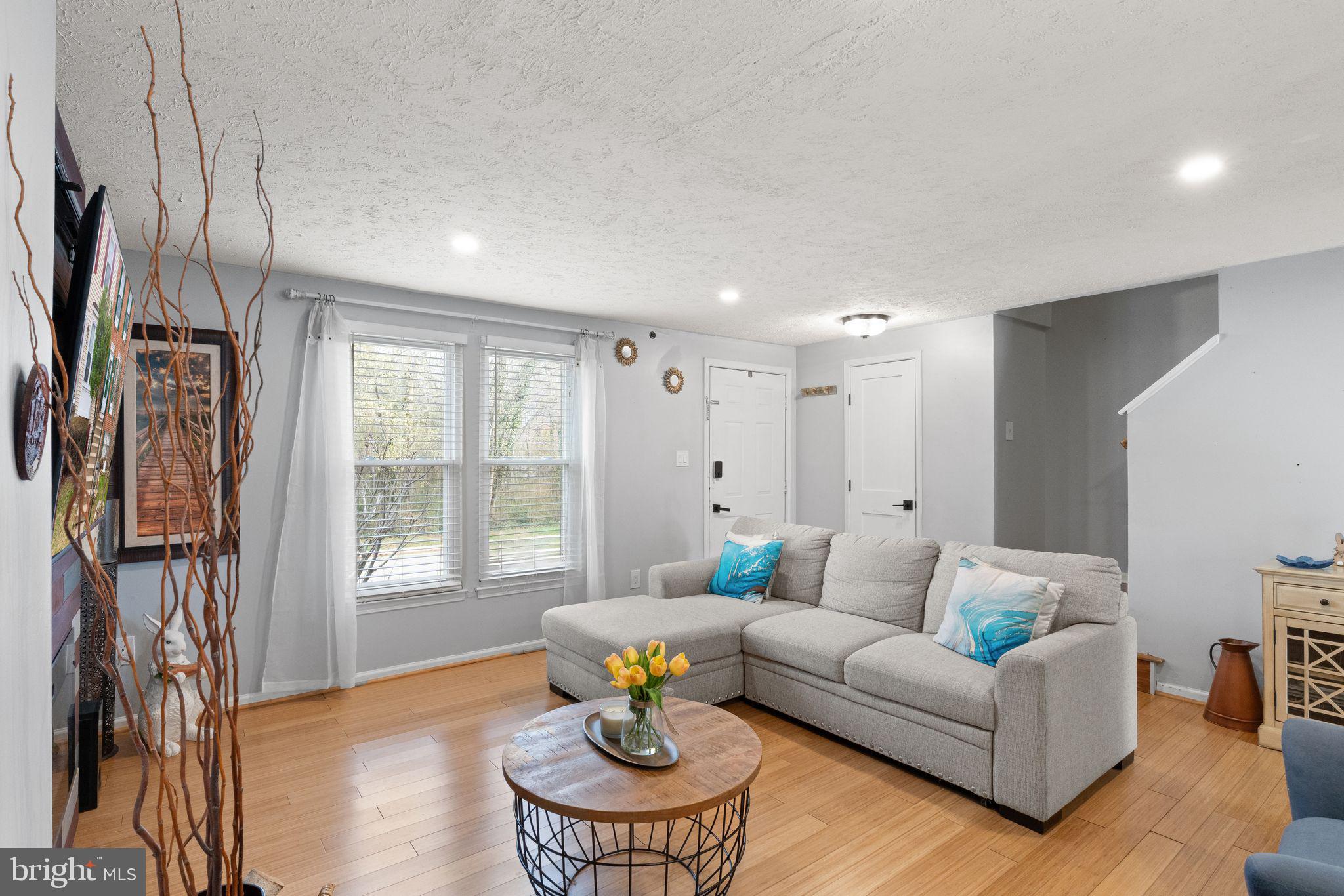7457 Wounded Knee Road Lorton, VA 22079 - Photo 6 of 49 a living room with furniture and a window