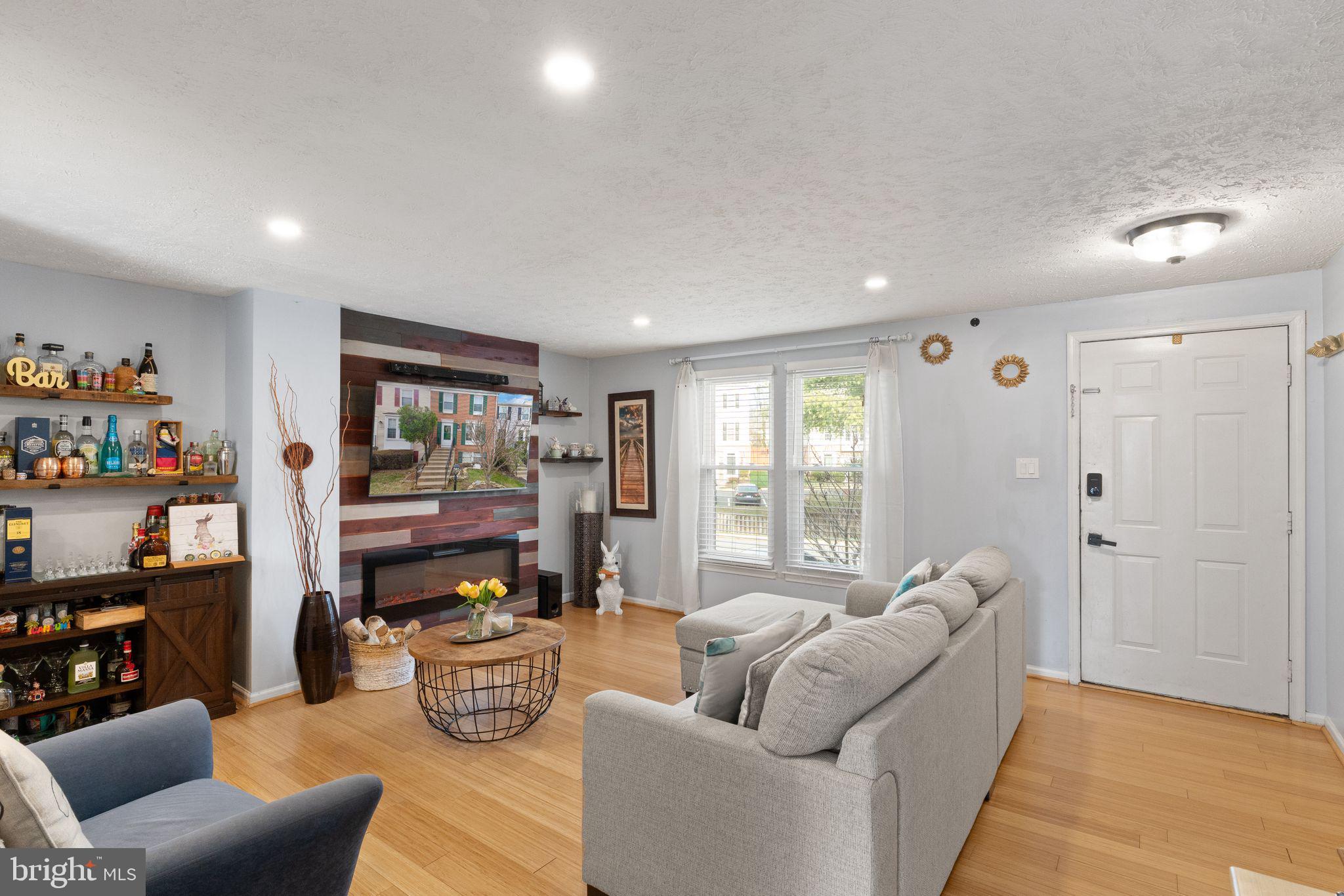7457 Wounded Knee Road Lorton, VA 22079 - Photo 8 of 49 a living room with furniture and a window