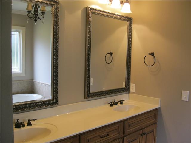 8070 Powells Chapel Road Murfreesboro, TN 37129 - Photo 13 of 19 a bathroom with a granite countertop sink and a mirror