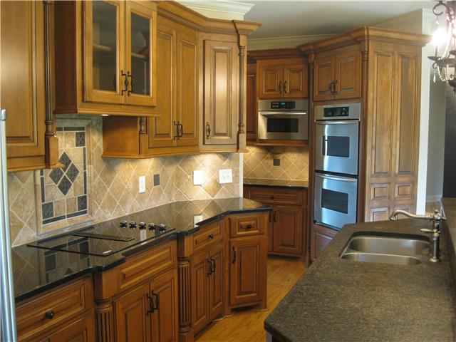 8070 Powells Chapel Road Murfreesboro, TN 37129 - Photo 6 of 19 a kitchen with stainless steel appliances granite countertop a stove a sink and a refrigerator