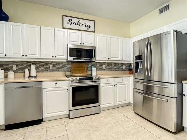 a view of a balcony with chairs and a table