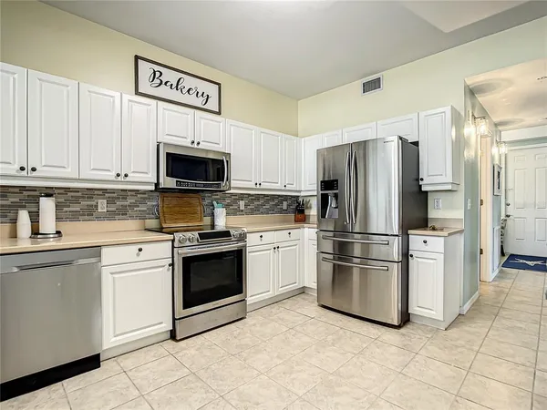 a bedroom with a bed and a view of living room