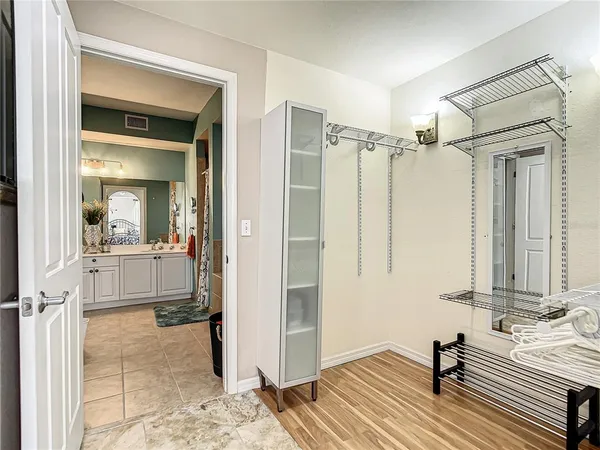 a bedroom with a large bed and a dresser