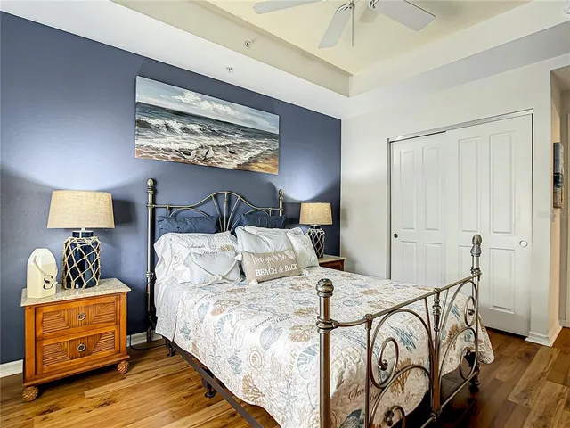 a bedroom with two beds and a chandelier