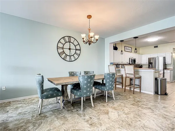 a kitchen with cabinets stainless steel appliances and a sink