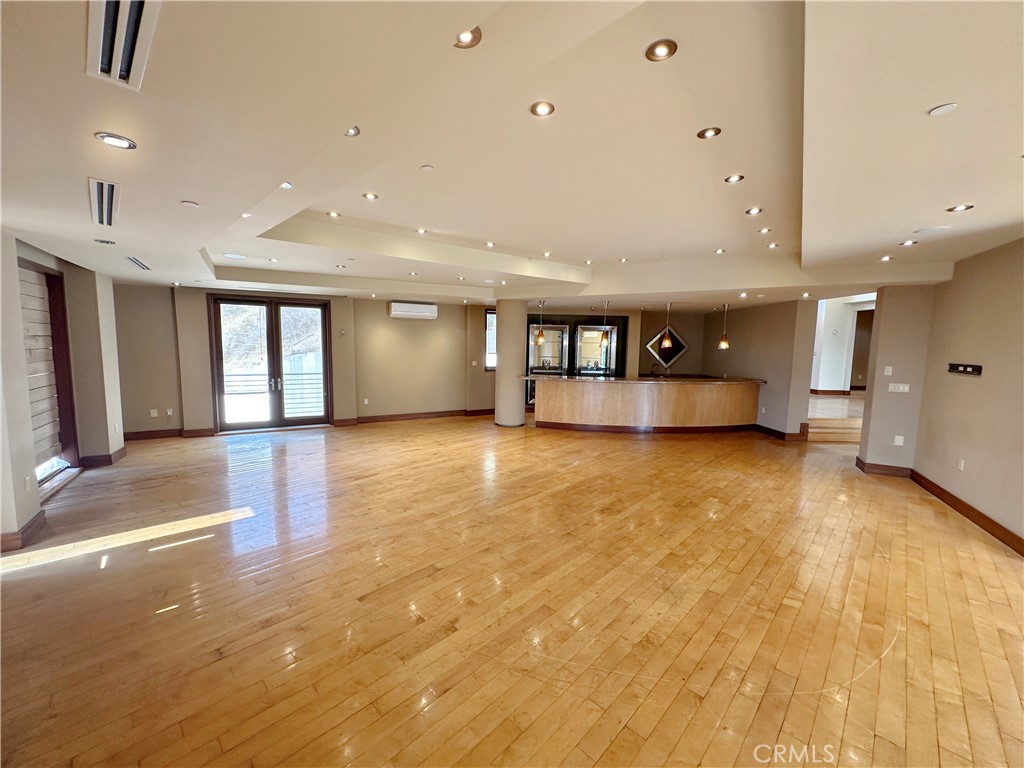 5077 Schumacher Road Calabasas, CA 91302 - Photo 13 of 58 a view of an empty room with a window