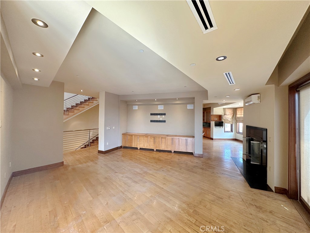 5077 Schumacher Road Calabasas, CA 91302 - Photo 15 of 58 a view of a hallway with a kitchen