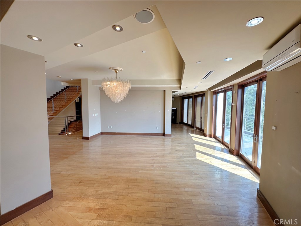 5077 Schumacher Road Calabasas, CA 91302 - Photo 16 of 58 a view of a hall with stairs