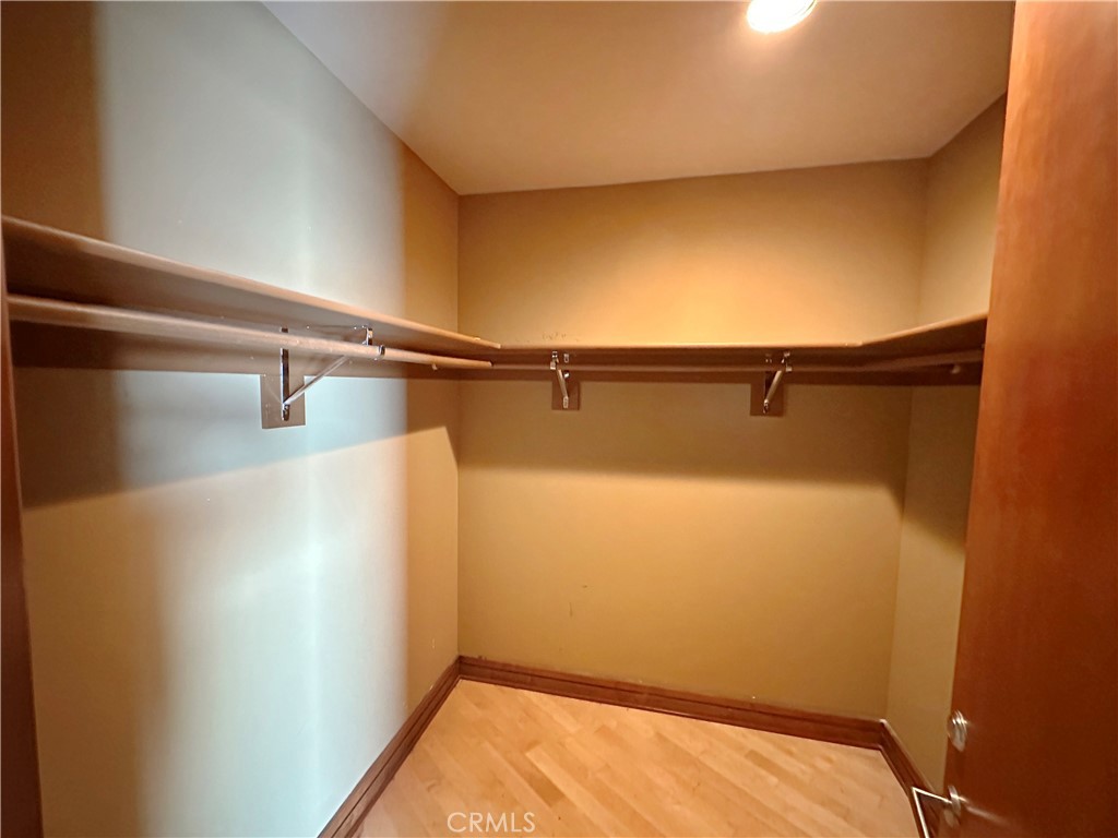 5077 Schumacher Road Calabasas, CA 91302 - Photo 20 of 58 a view of a room with racks on the wall